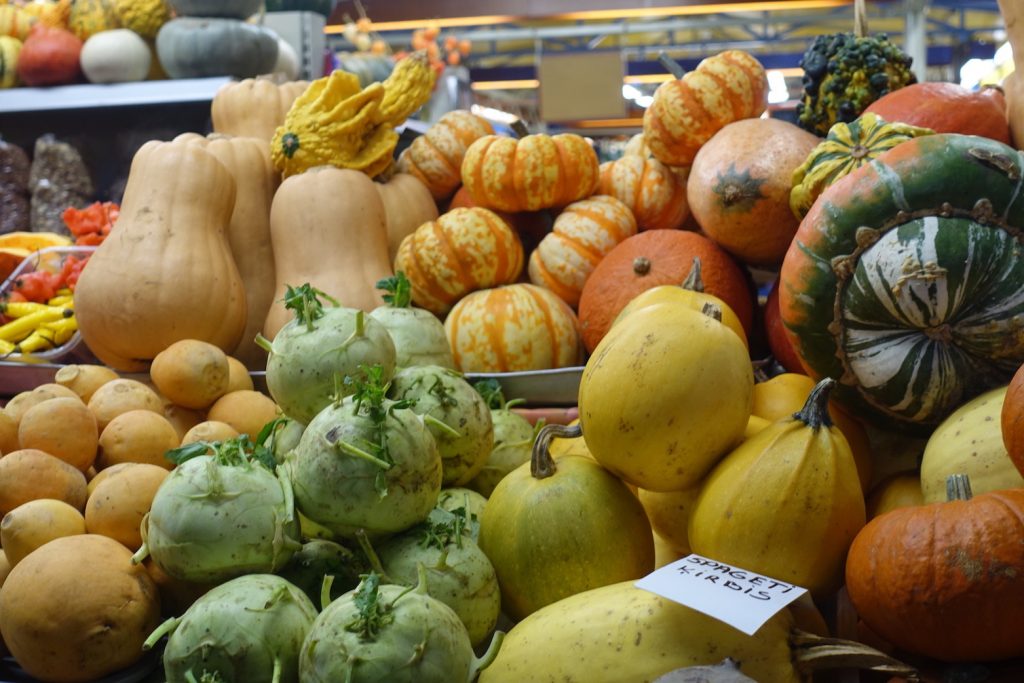 This is the picture of some pumpkins in a stall in Riga central market.