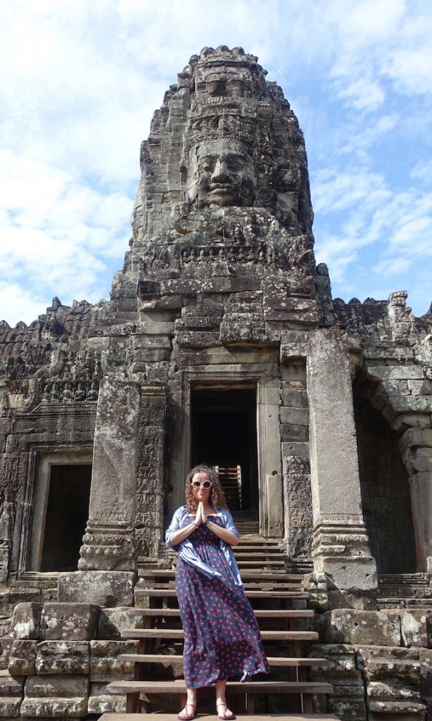 Pilar at the entrance of the Bayon temple in prayer position.