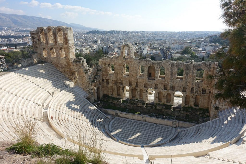 A view from the top of the Odeon of Herodes Atticus and the city of Athenas on the back.