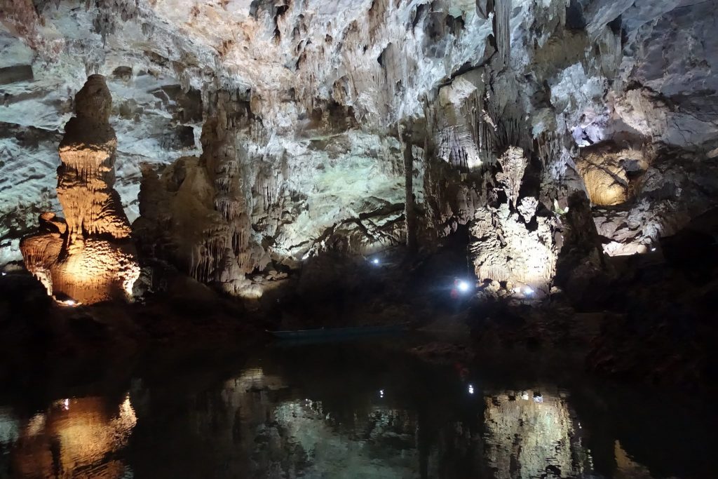 Some formations on the interior of Phong Nha cave and their water reflections.