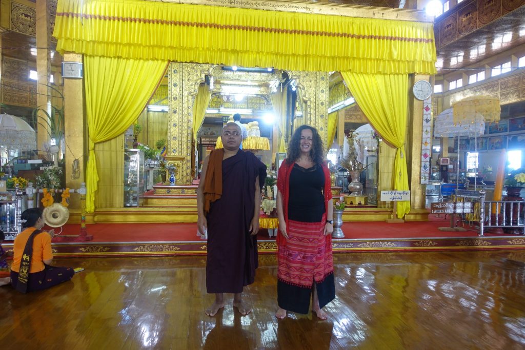 Pilar with a Buddhist monk after meditation in a buddhist temple in Inle lake