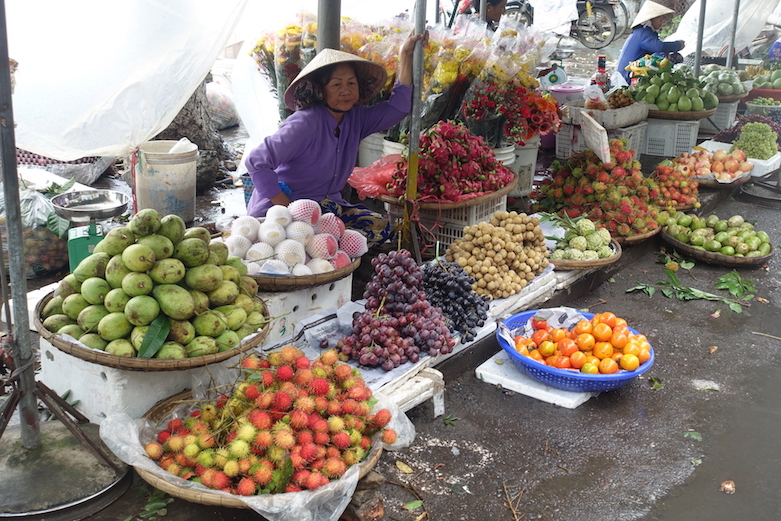 Women selling vegetables in the local food market in Ben Tre