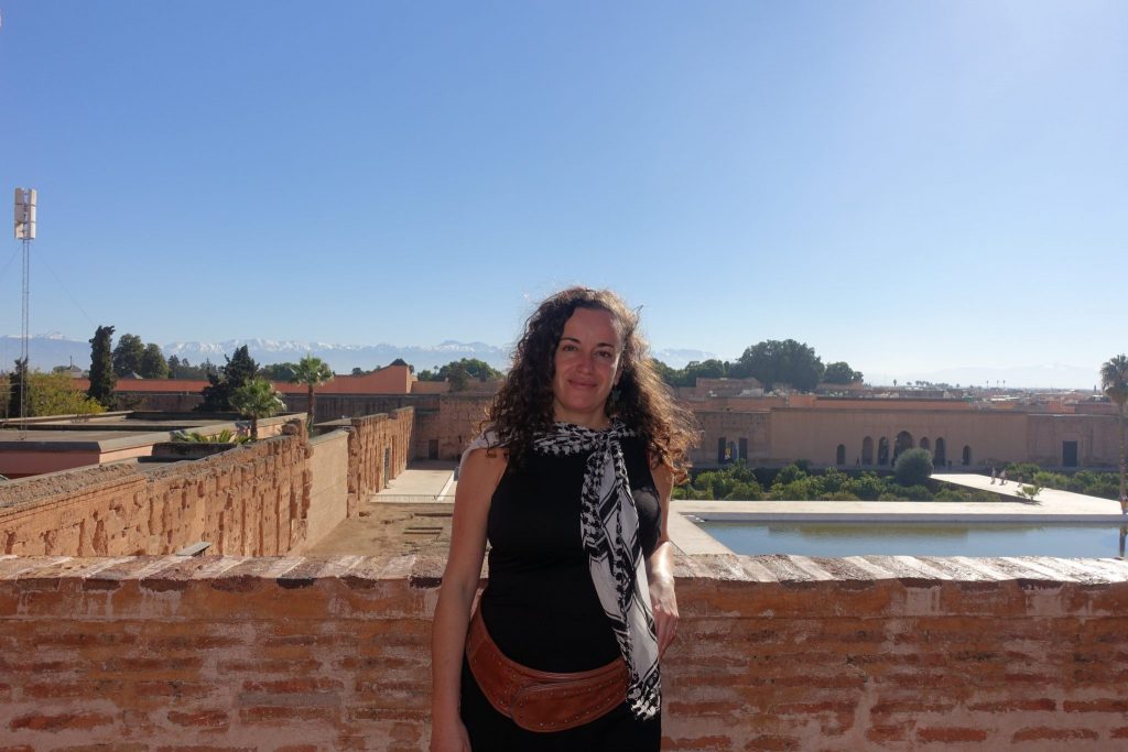 Pilar at El Badi palace and the Atlas mountains on the background