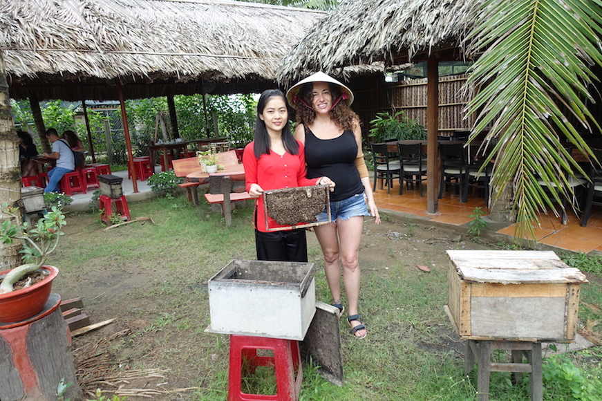 Pilar and a tour guide at the bee factory during the Mekong delta tour in Ben Tre