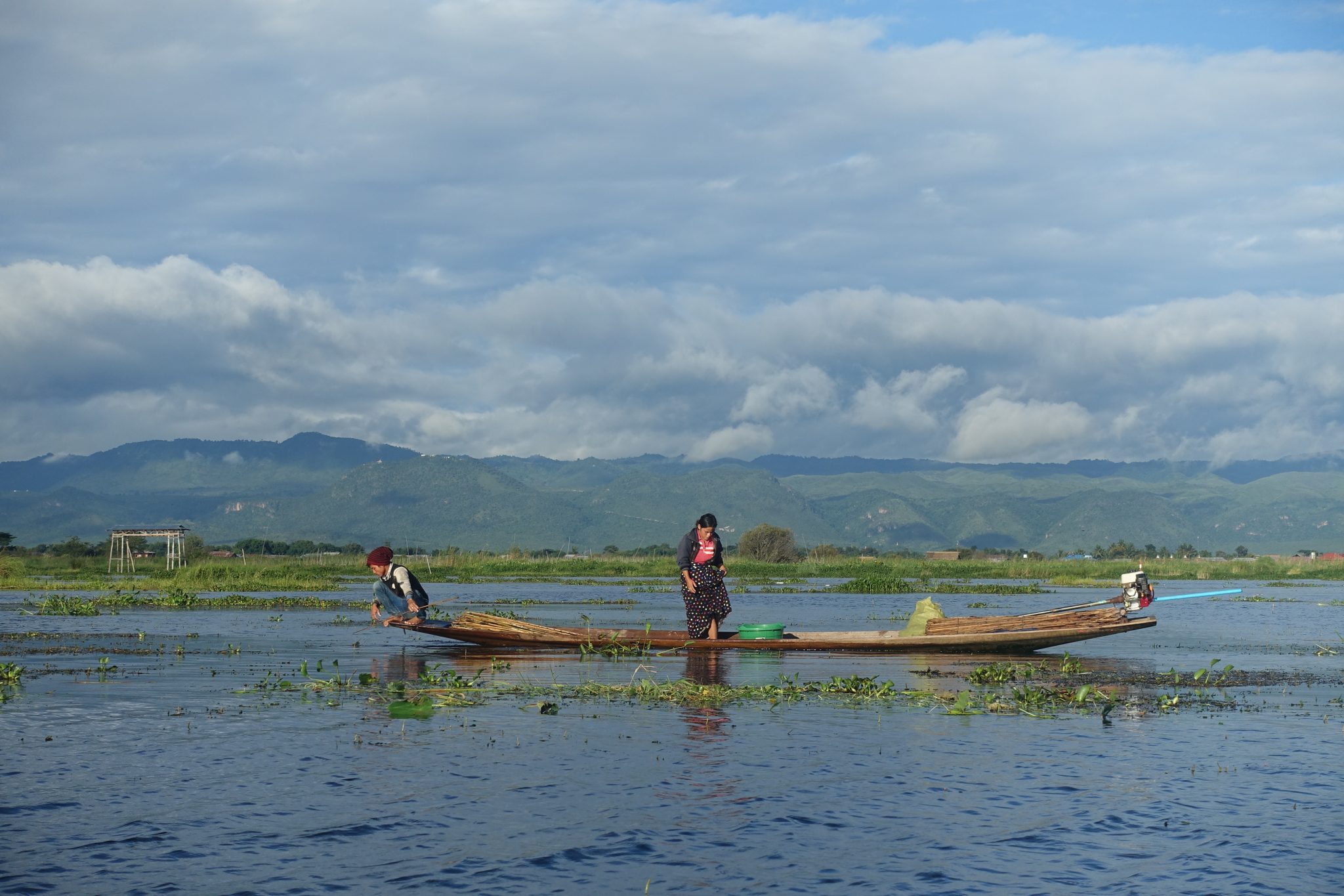 Fishermen on a boat in Inle lake at sunrise time