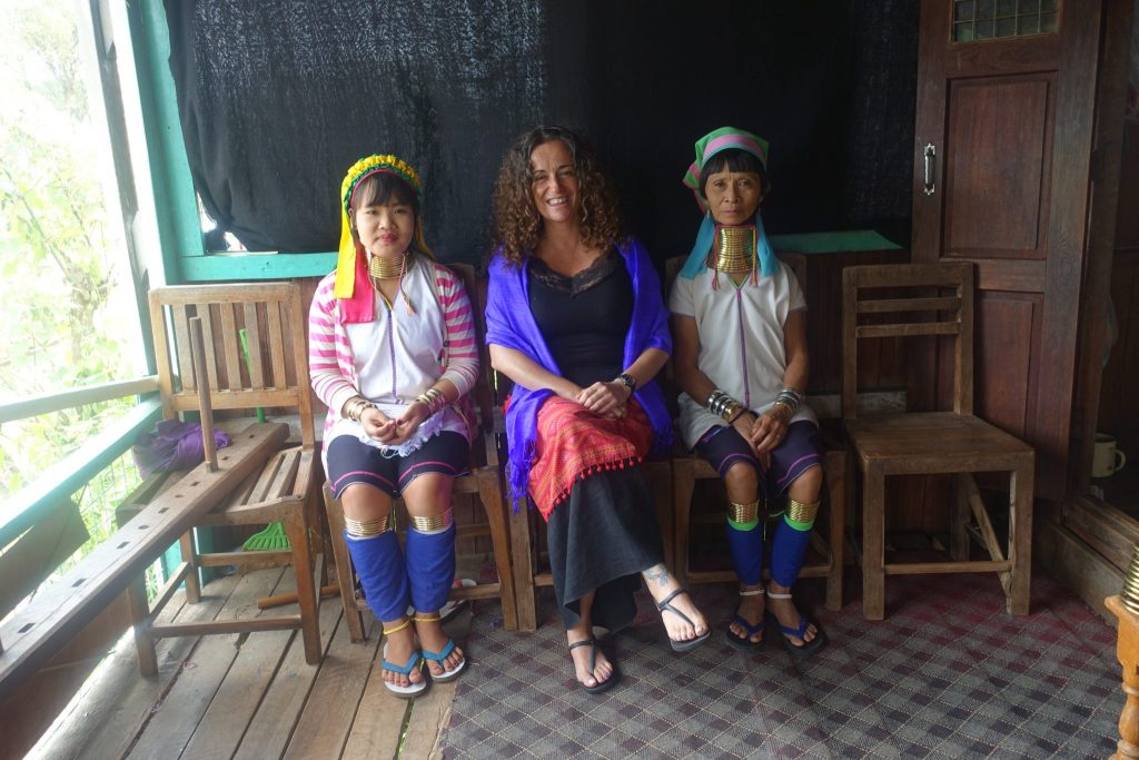 Pilar posing with the long neck women at a local business in Inle lake