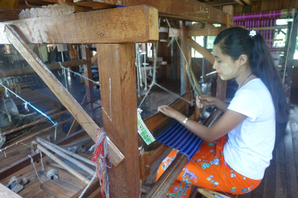 Woman weaving at the Lotus flower farm