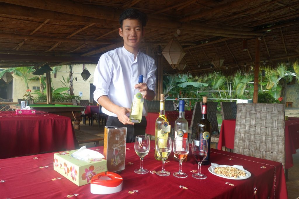 Waiter serving different wines for tasting at the Aythaya winery