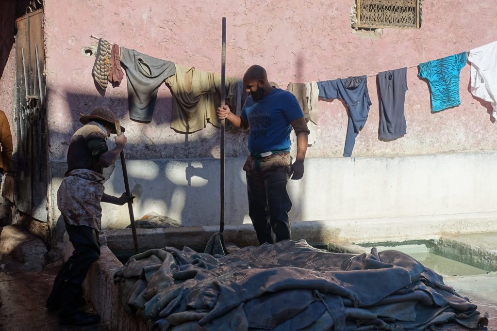 Workers at the Marrakech tanneries