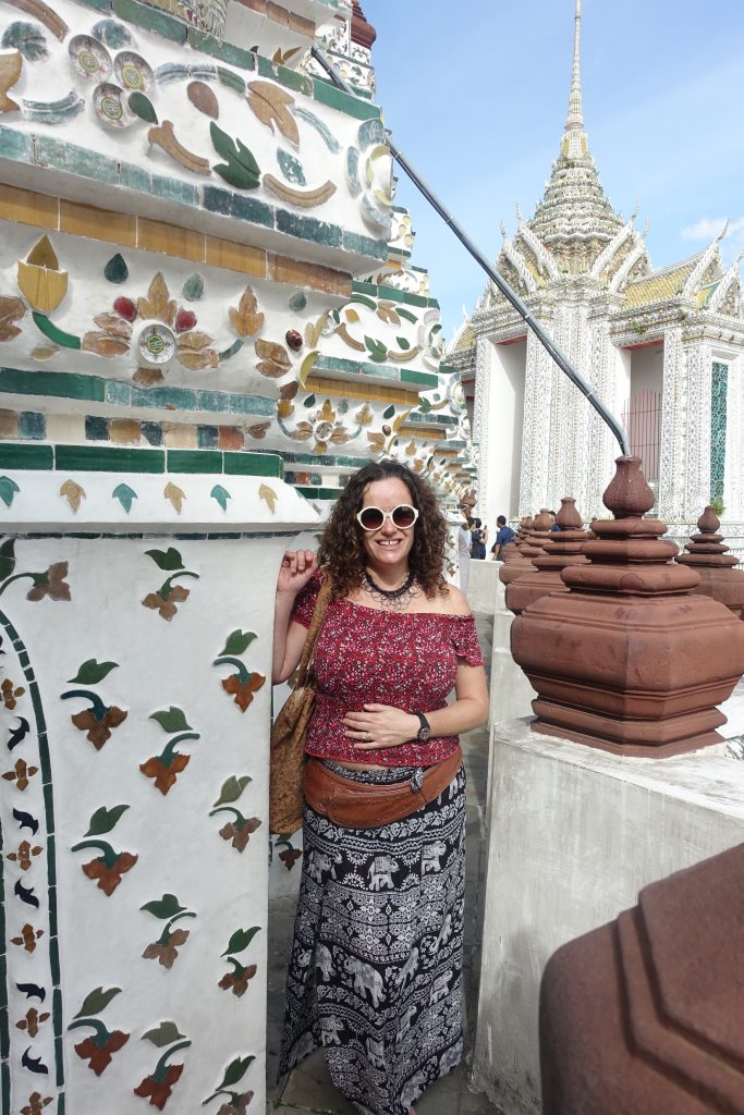 Pilar on top of one of the Wat Arun temple towers. You can see one of the temple domes at the back of the picture