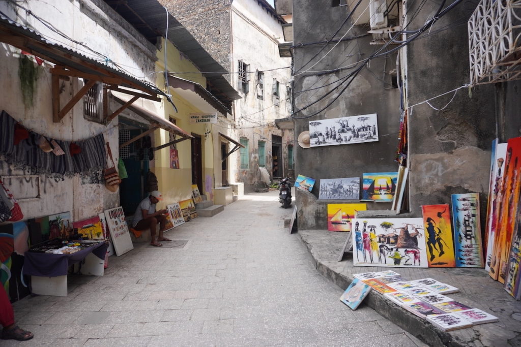 Things to do in Stone Town, Zanzibar: Little alley with local paintings 