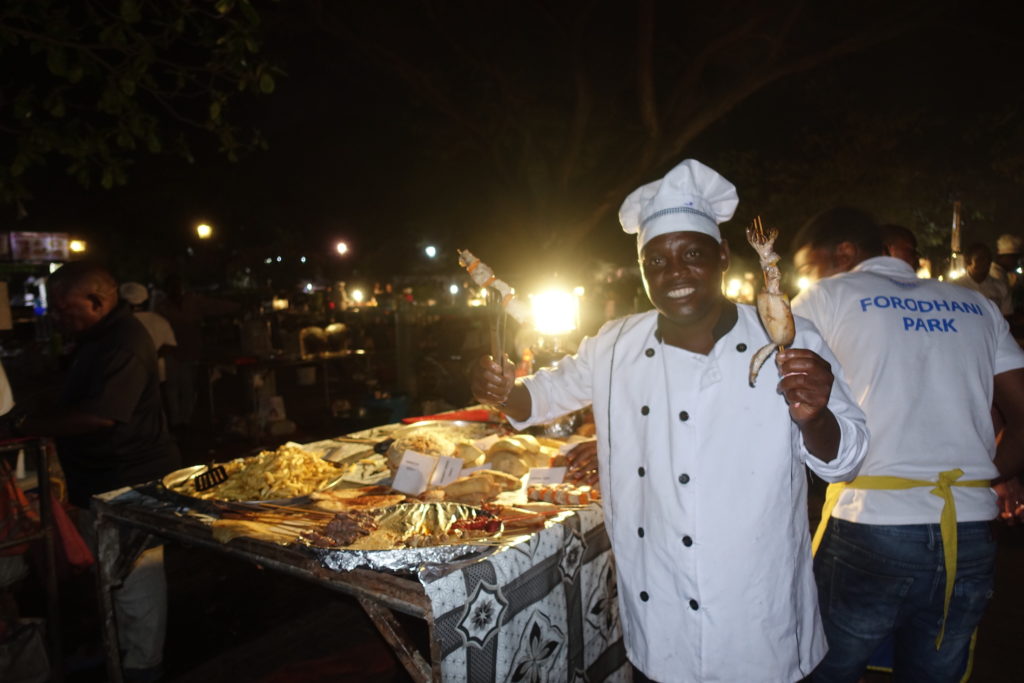 A food vendor at Forodhani park at night, Stone Town