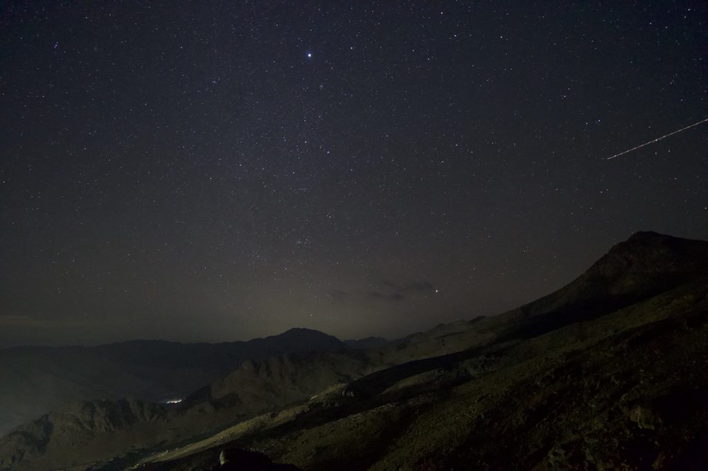 A view of the night sky with a falling star during the Mount Sinai climb