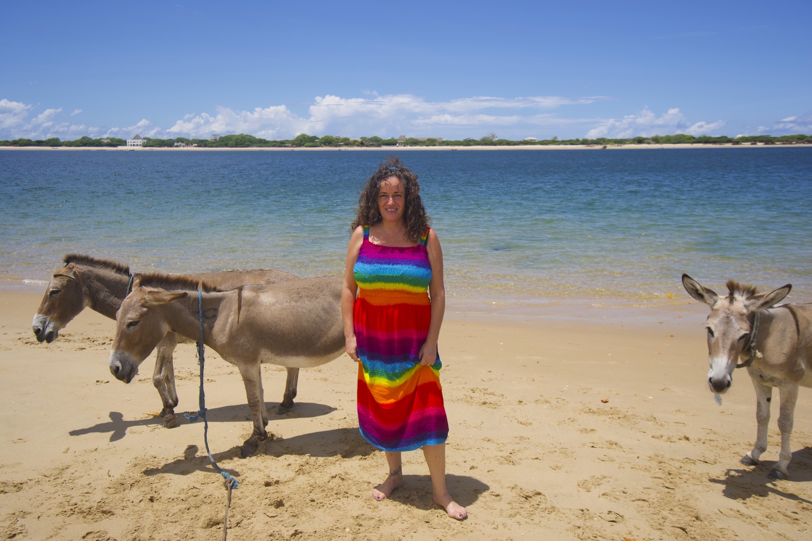 Pilar at the sea side of Shela beach with some donkeys