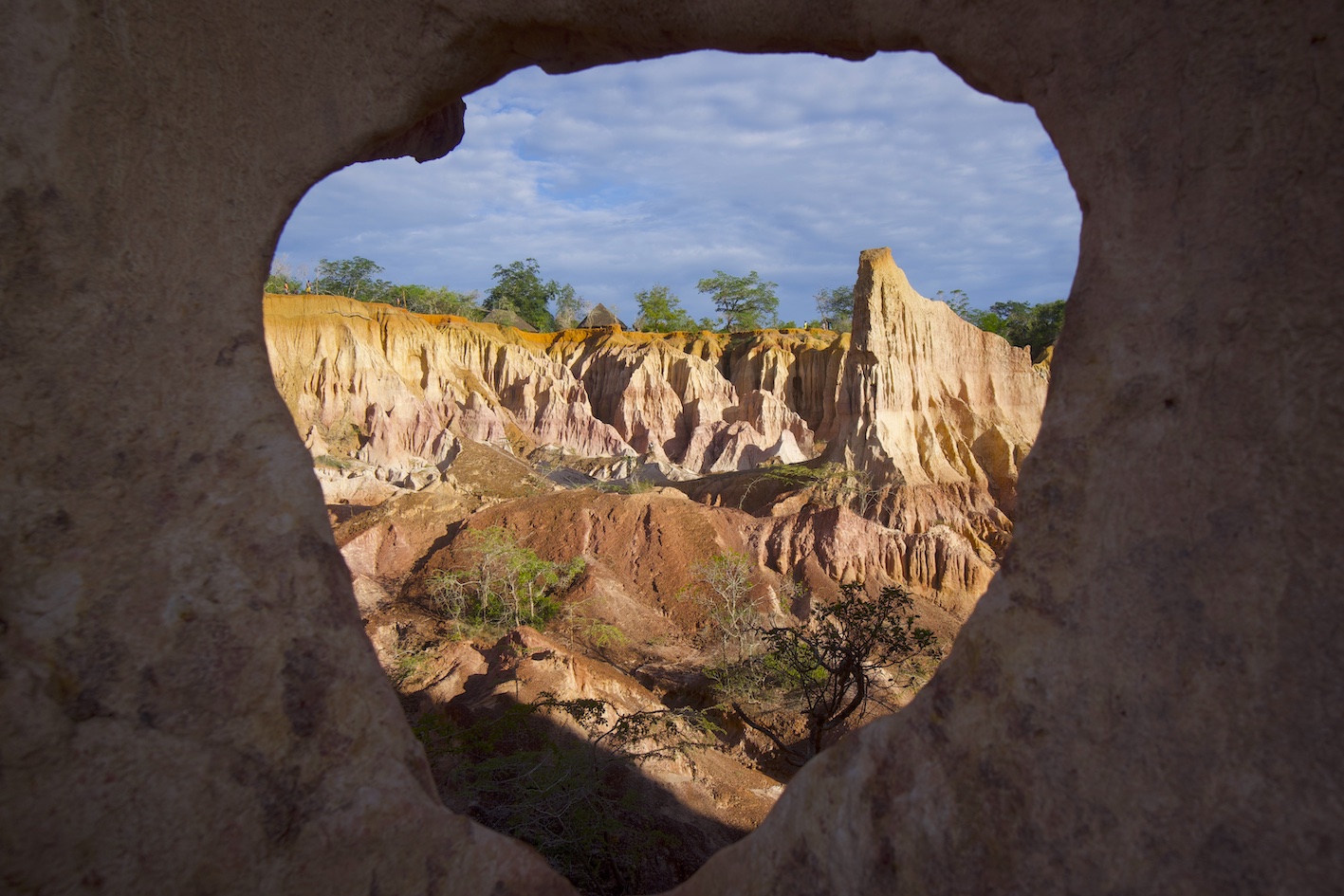 A view of Malindi Hells Kitchen through a hole created by the minerals chemical reaction