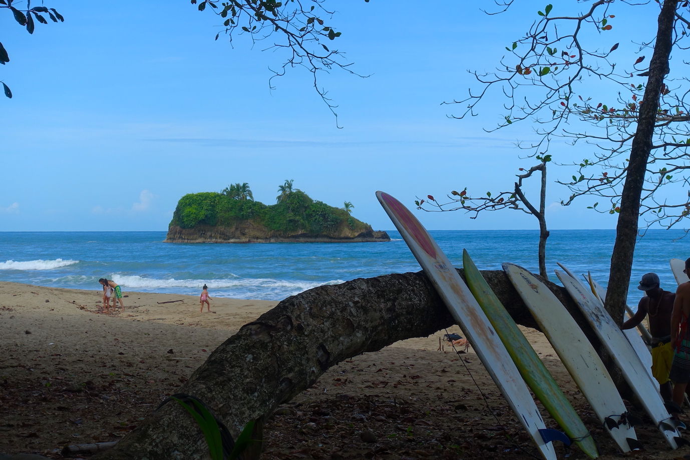 Playa Cocles one of the most popular beaches in Puerto Viejo. You can see some surfboards and the island close to the beach