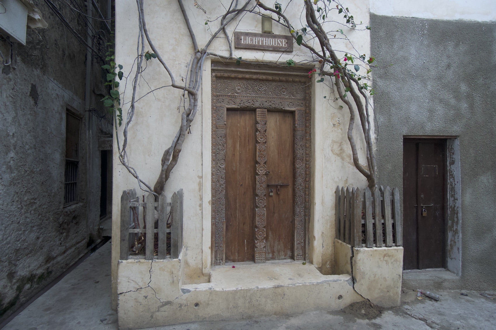 House door with some branches and flowers at Lamu Old Town