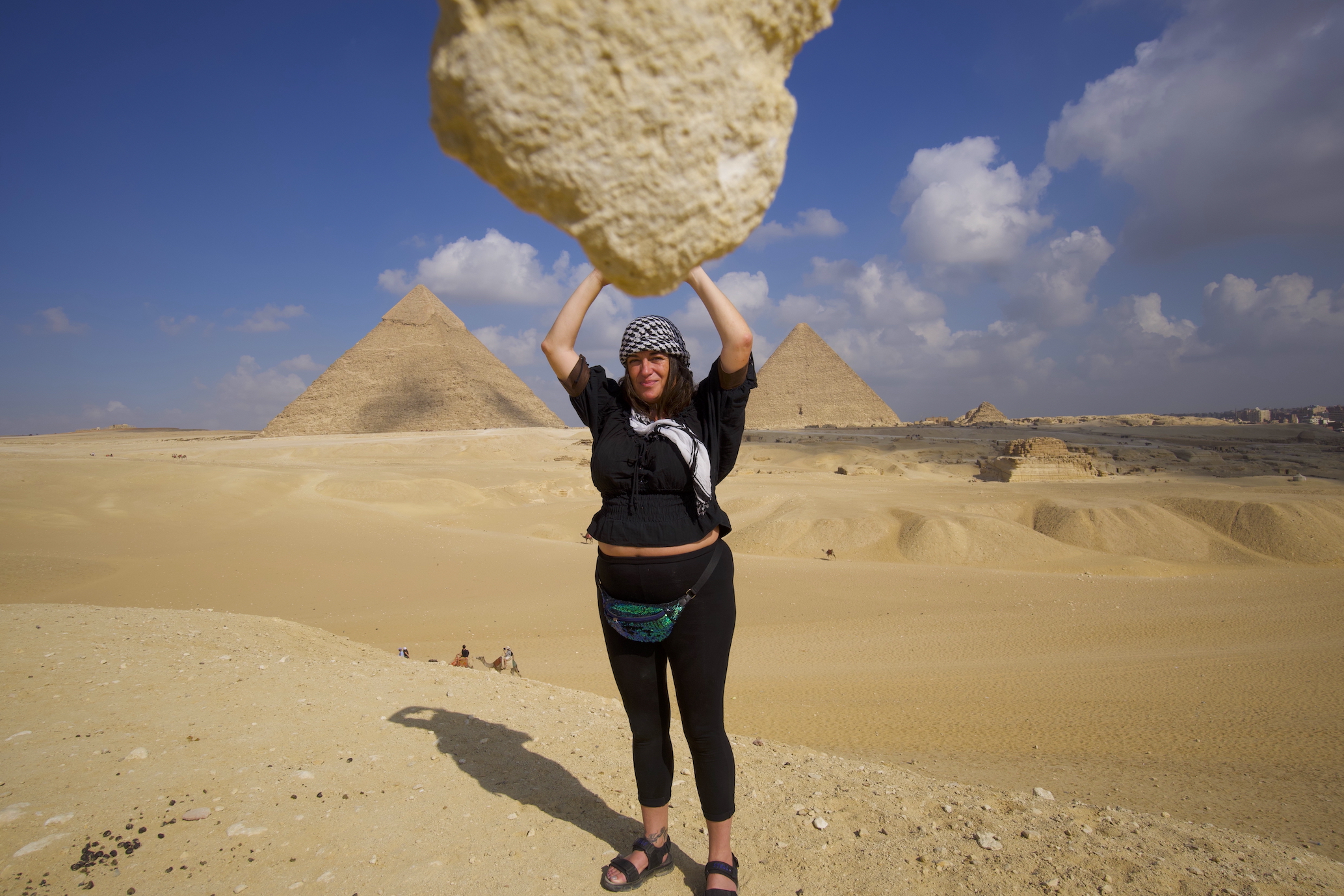 Pyramids panorama view point and photo with Pilar looking as if she is carrying a big stone