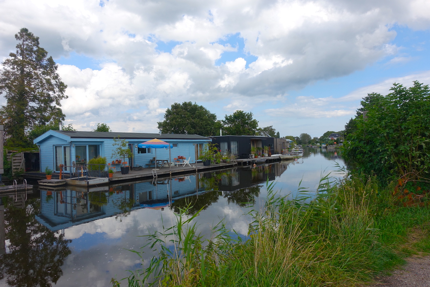 House boats on a canal in Broek in Waterland on the way from Amsterdam