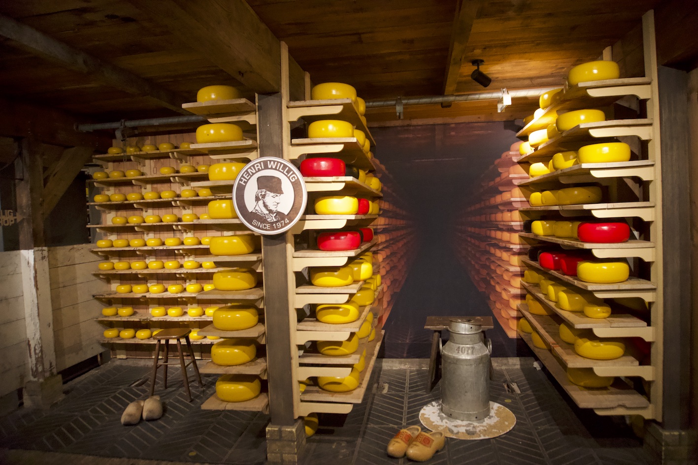 Some shelves with lots of cheese at the Henri Willig cheese factory in Zaanse Schans