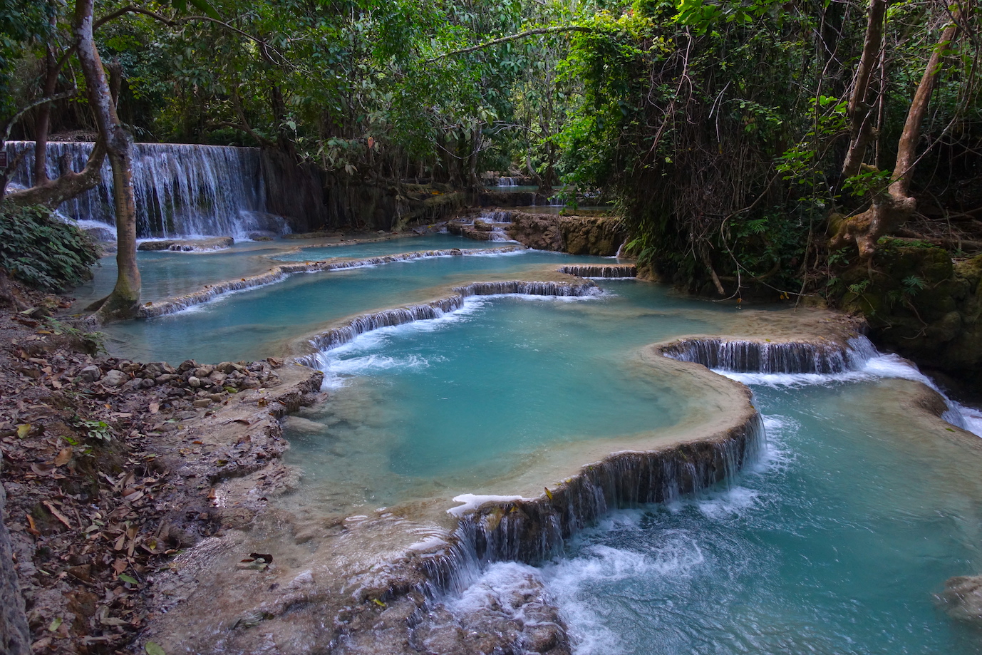 Pools at sunset time in the Kuang si waterfalls