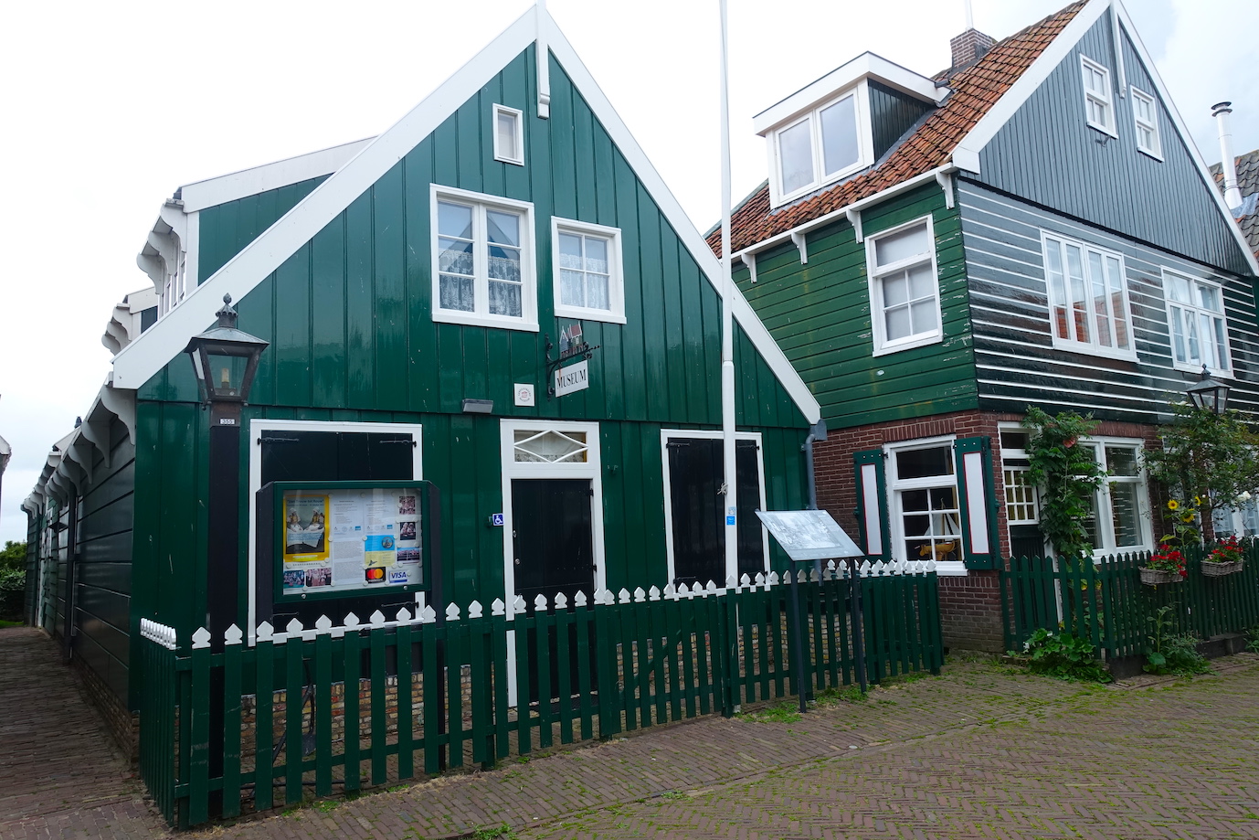 A view of the Marken museum, that is a green typical Marken wooden house
