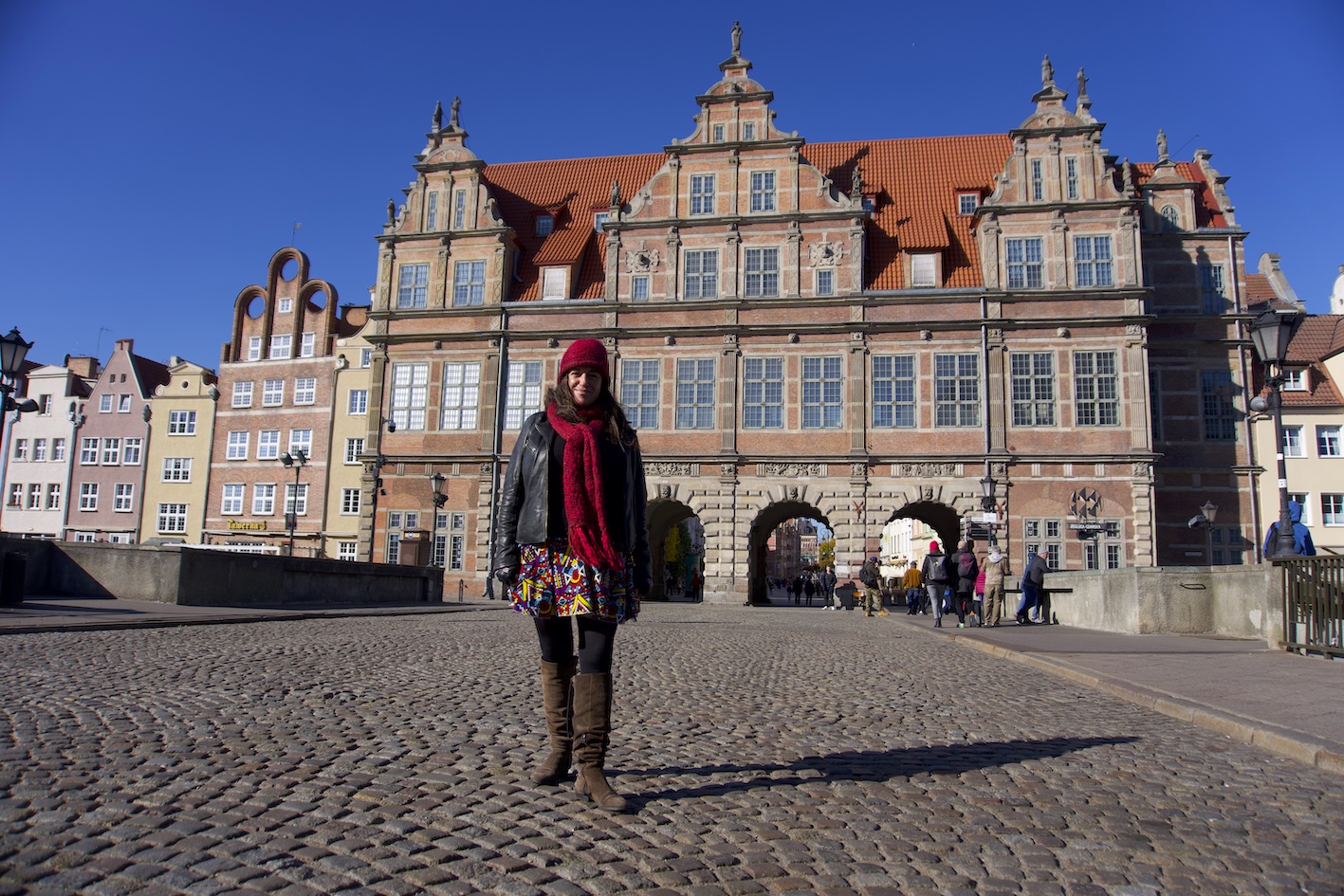Pilar standing in front of the Green Gate in Gdansk, Polland