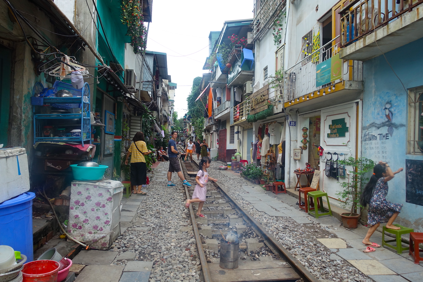 Children on the rail tracks at Hanoi Train Street