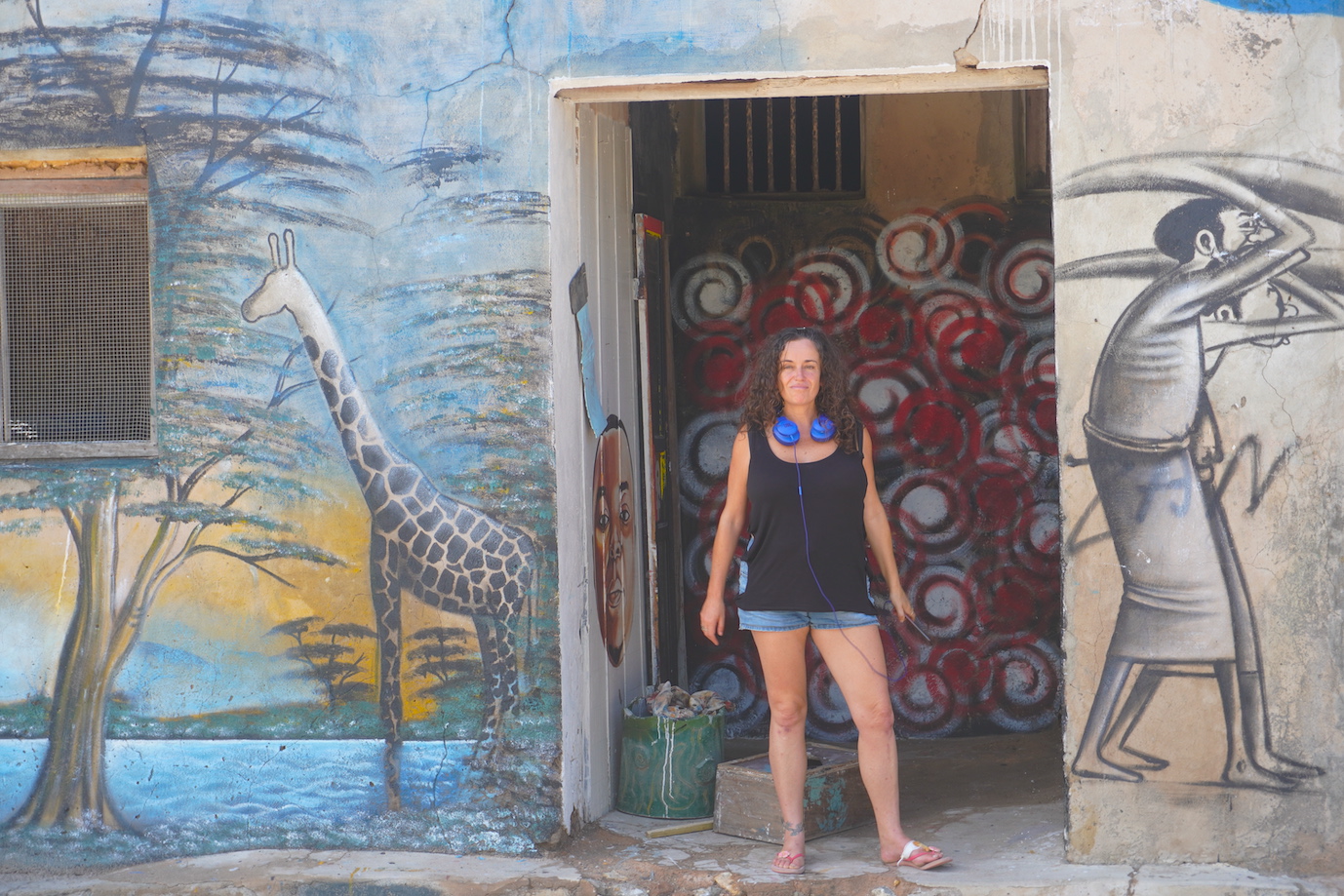 Pilar with some street art at the Kilwa Kivinje