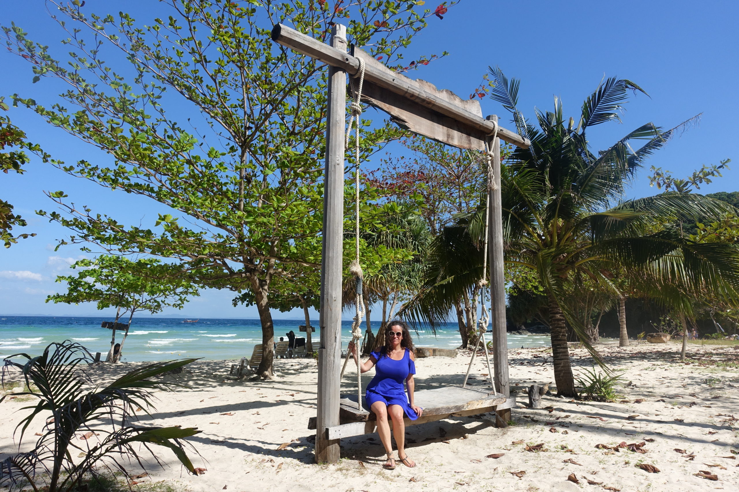 Pilar sitting on a swing on the secret Koh Phi Phi beach
