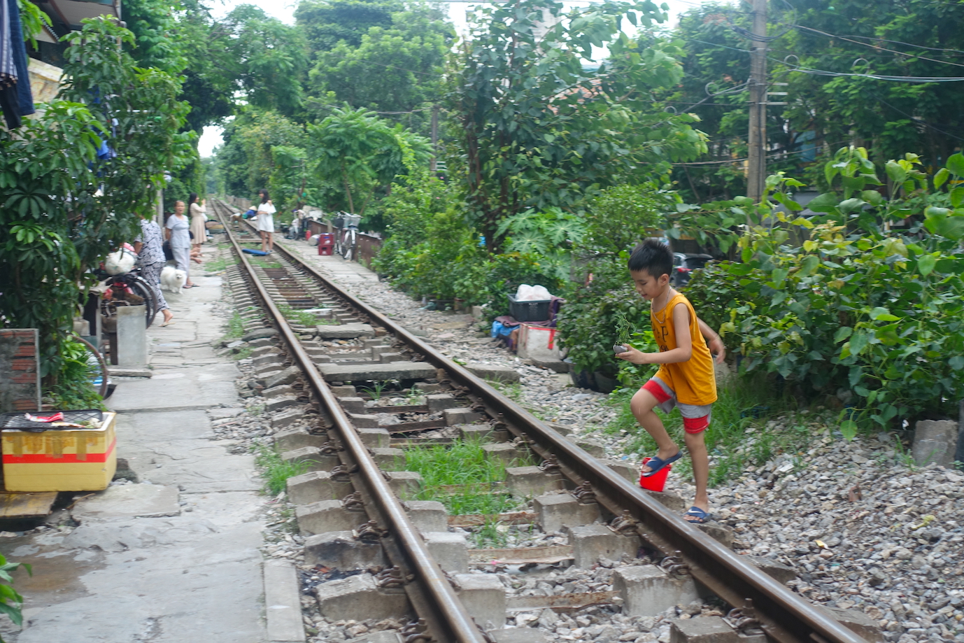 Children on tracks on Hanoi Train Street
