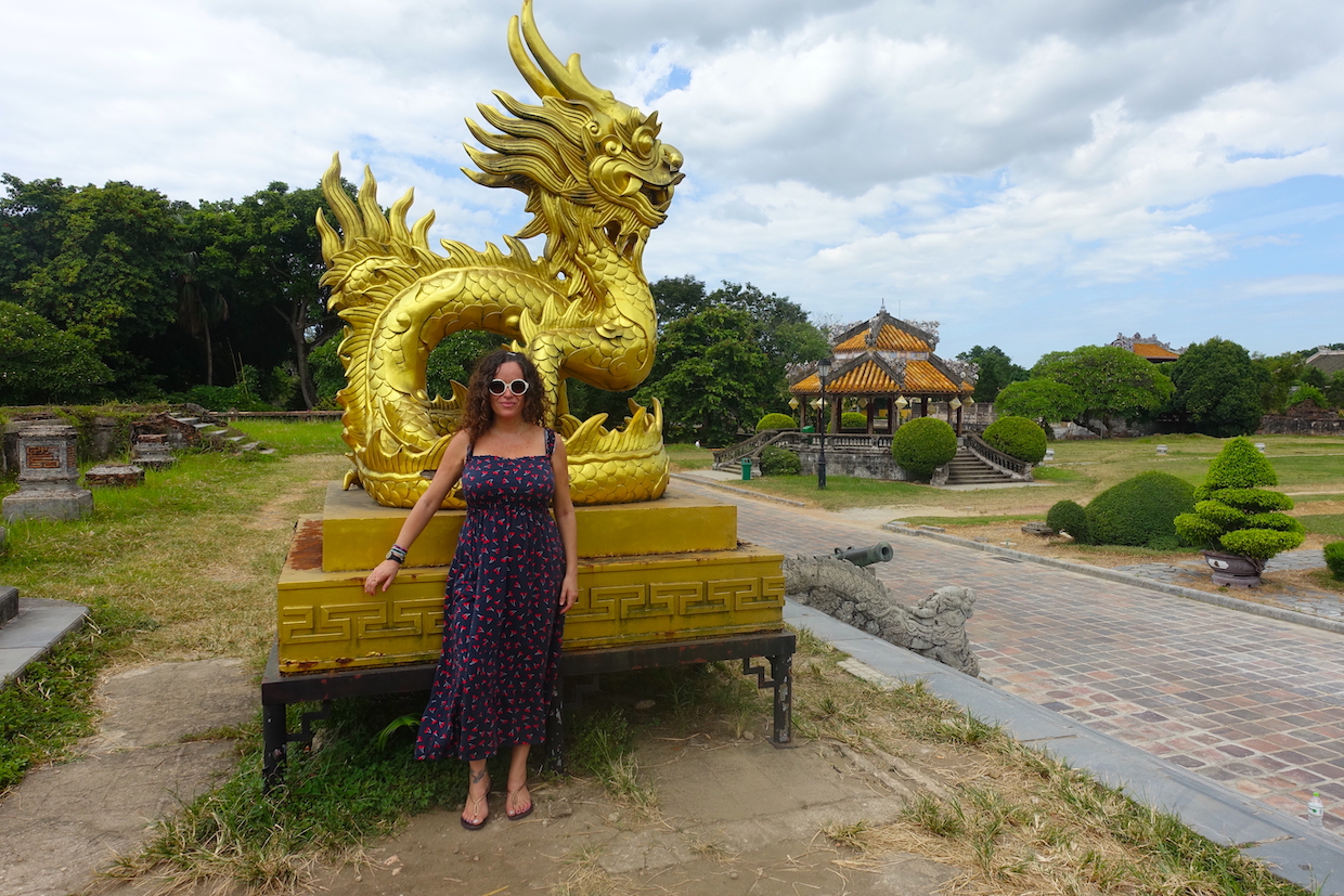 Pilar with a golden dragon in the Hue citadel in Vietnam