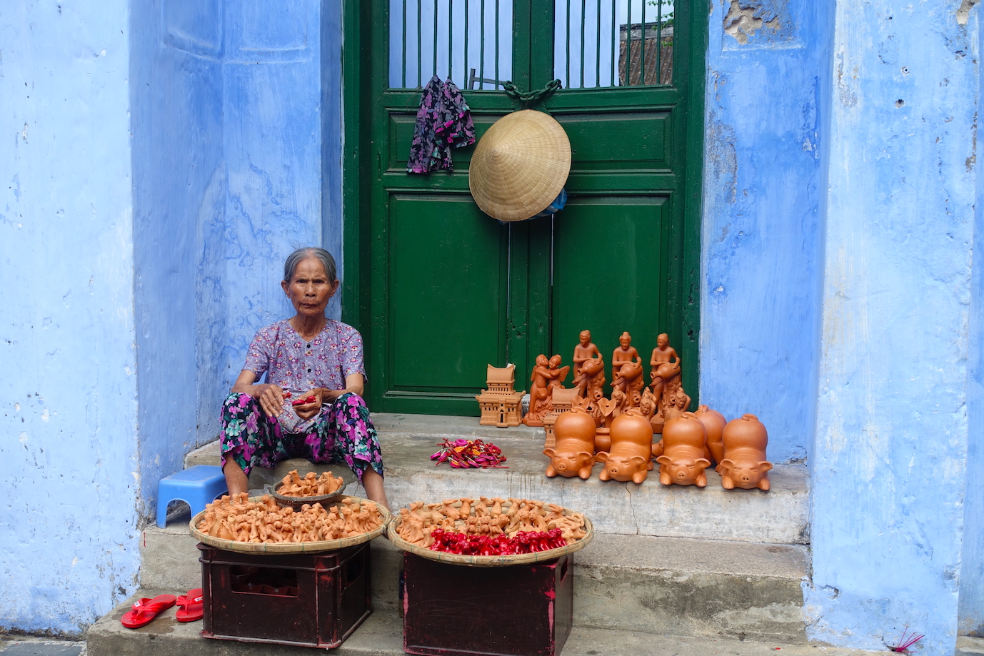 Woman selling stuff on the streets in Hoi An