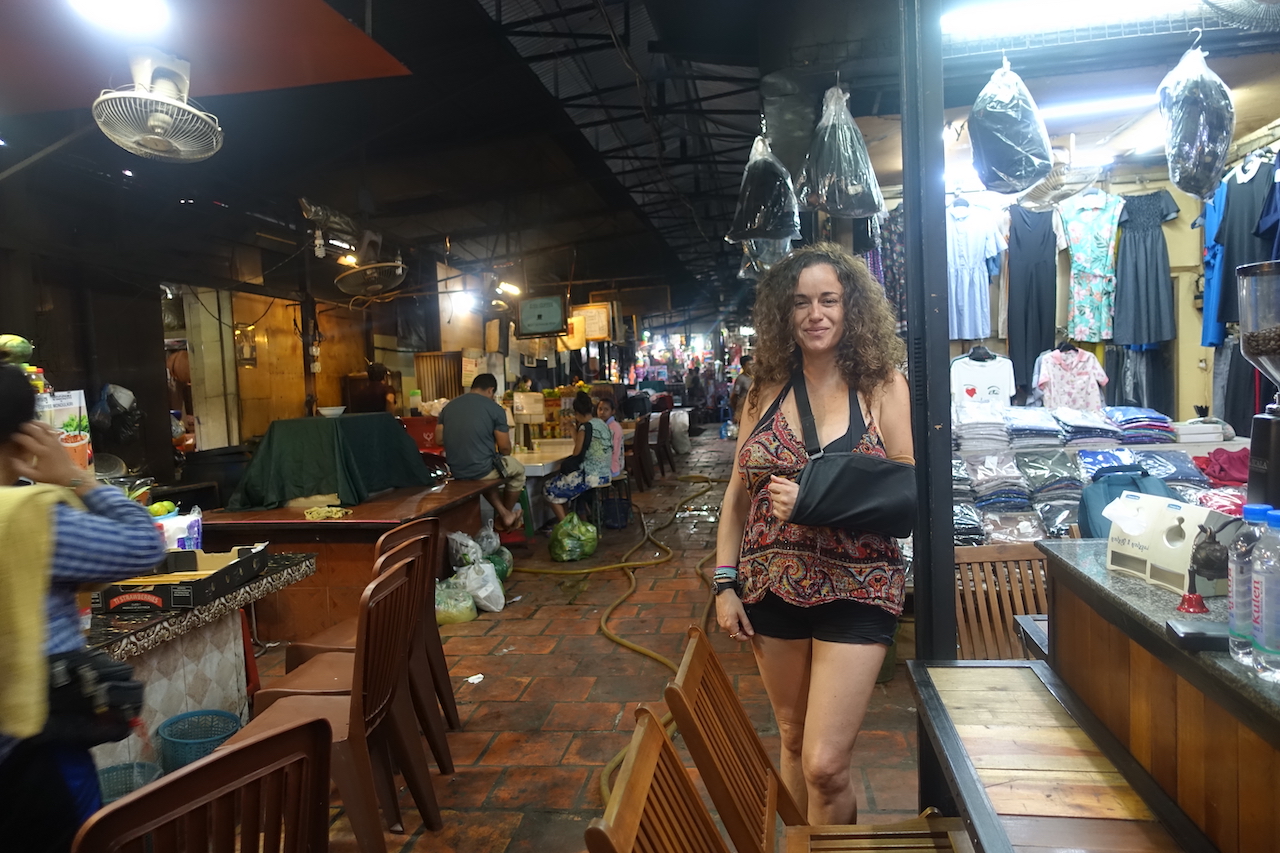 Pilar posing among some stalls in the interior of the Russian Market