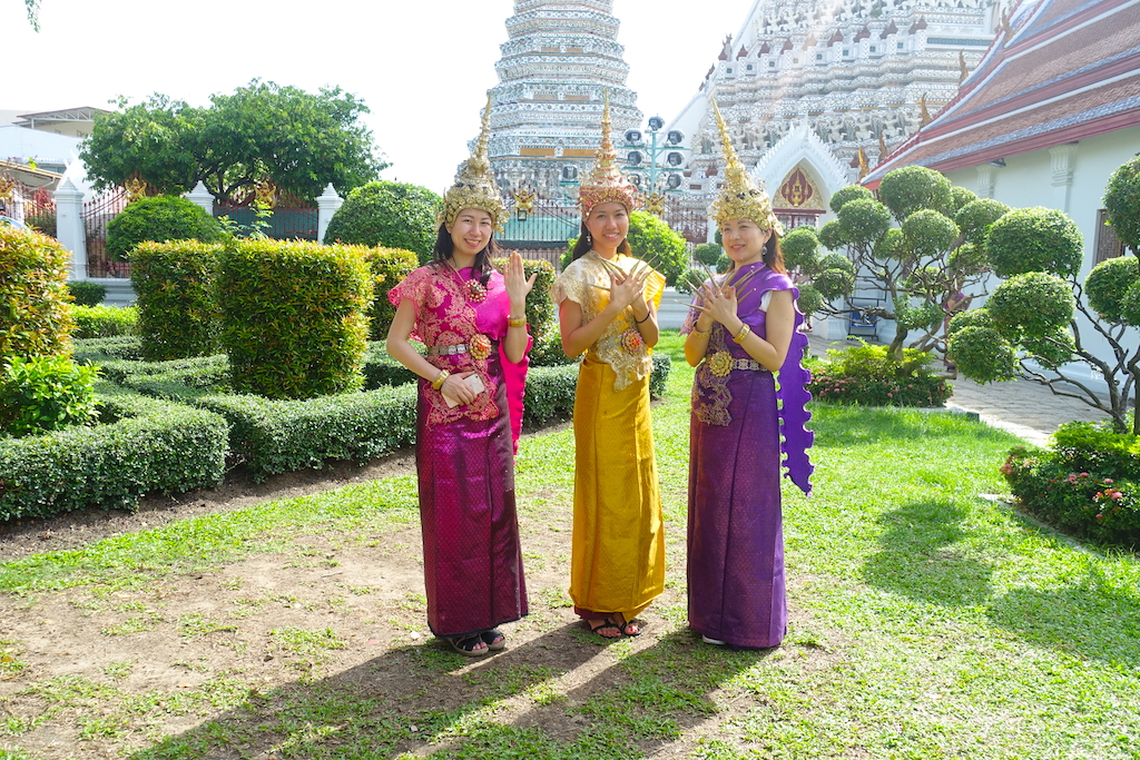 Thai dancers dressing the traditional custom in the Wat Arun temple in Bangkok