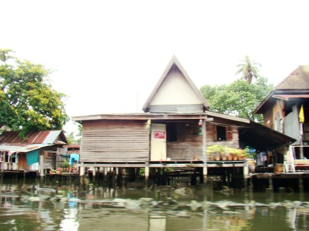 Wooden houses along the canals during the Bangkok canal tour