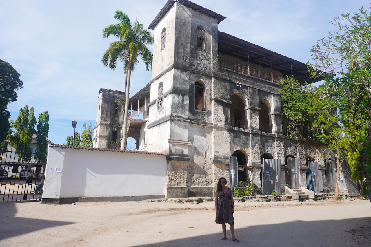 Pilar standing in front of the Bagamoyo old boma