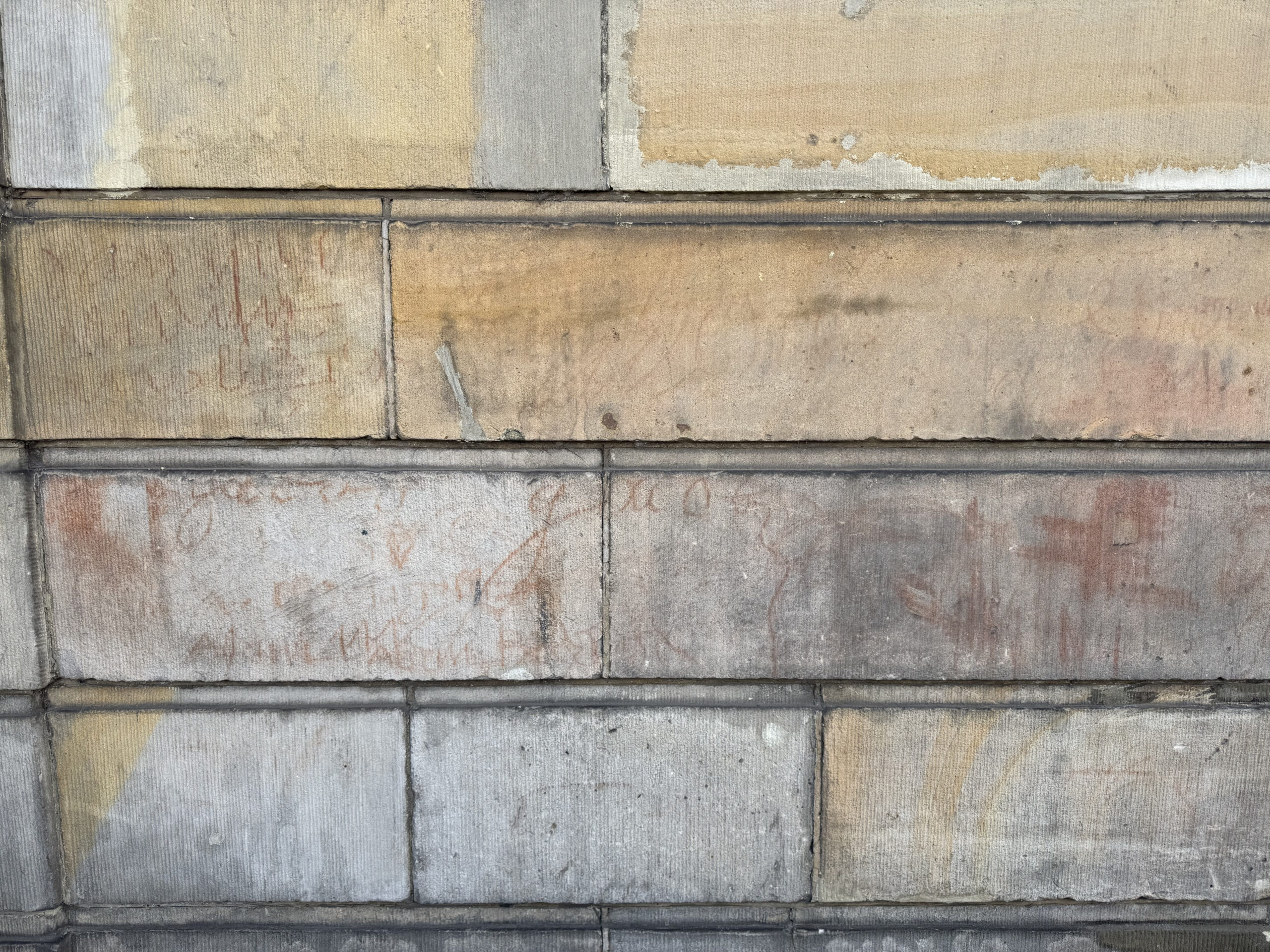 Wall with red stains in Amsterdam known as the house with the blood stains, a location tied to dark legends and mystery