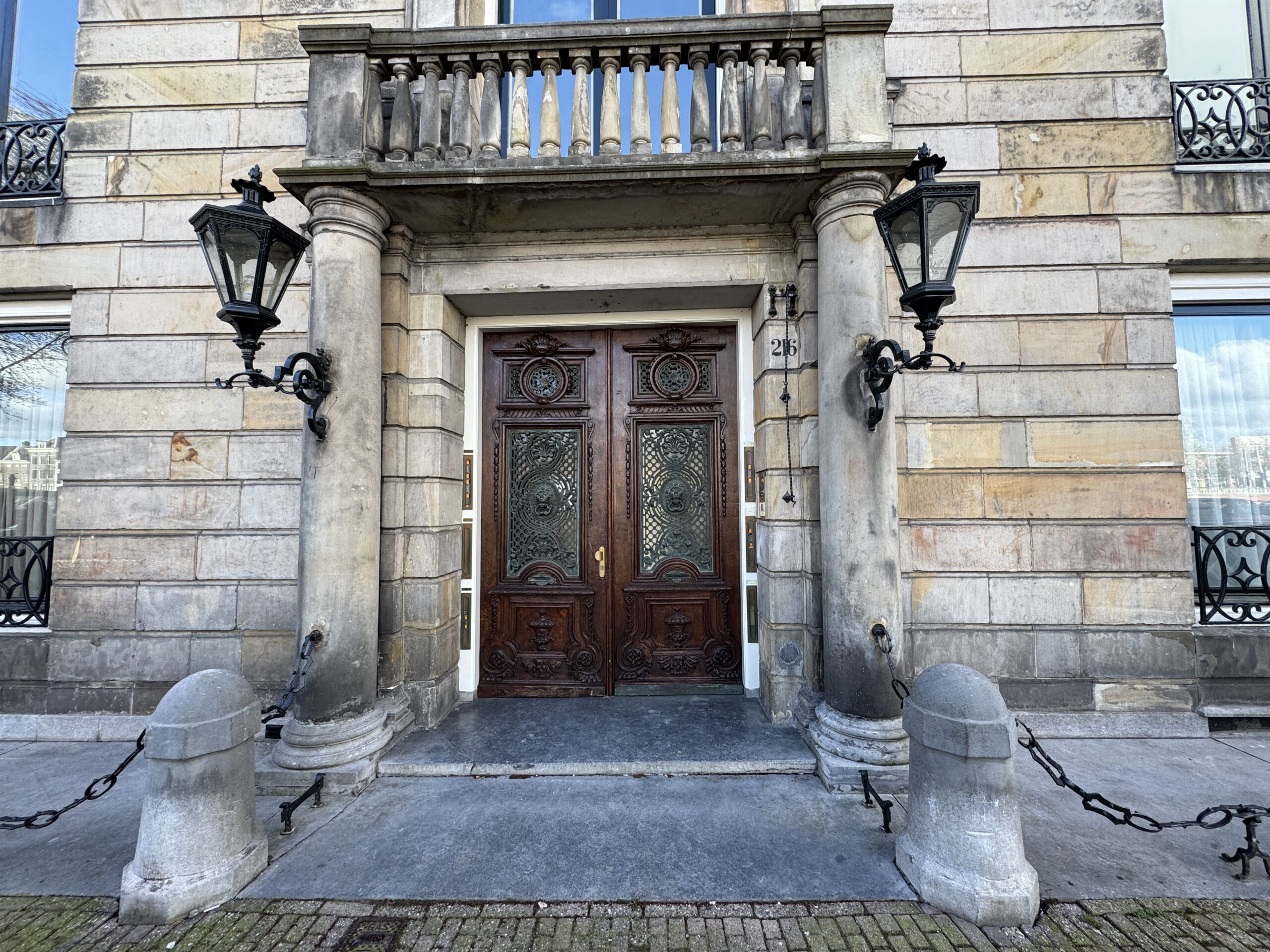 Entrance door to Amstel 216 in Amsterdam the haunted house of the bloodstain that can be seen on the walls around the entrance