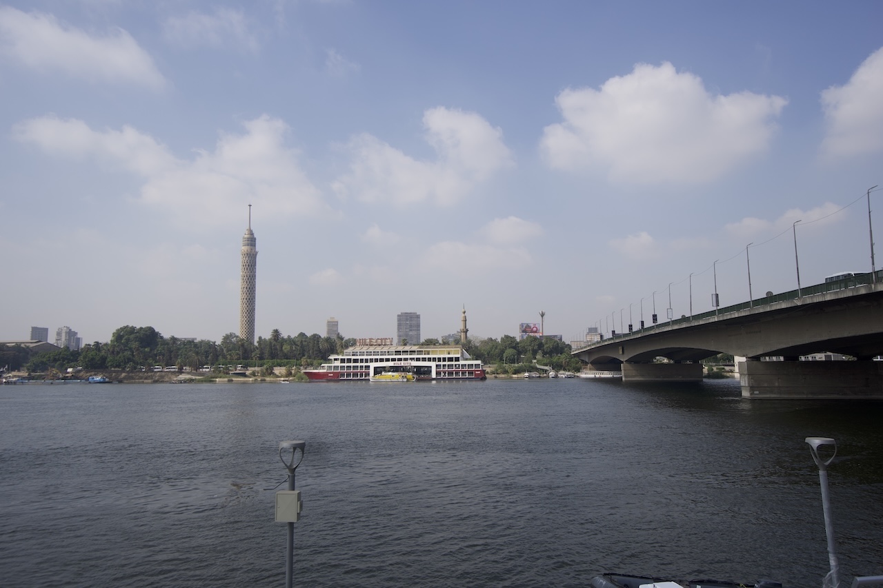 View of the Nile River in Cairo with mosque and city skyline