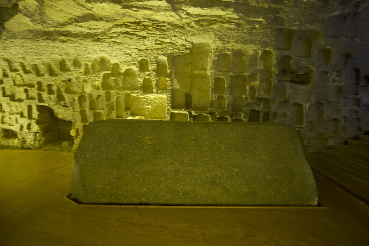 Stone sarcophagus inside underground burial chamber in Saqqara