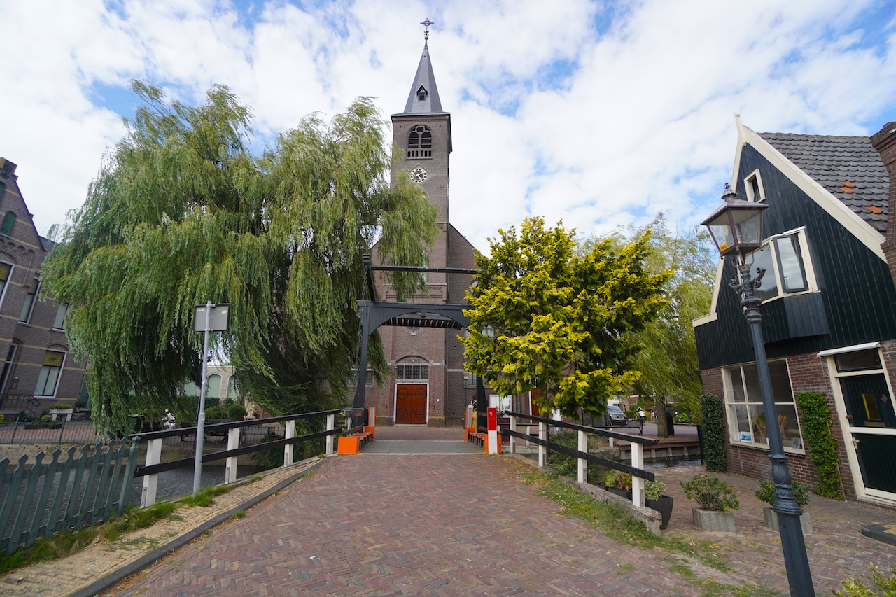 St Vincentius Church in Volendam surrounded by traditional houses and canals