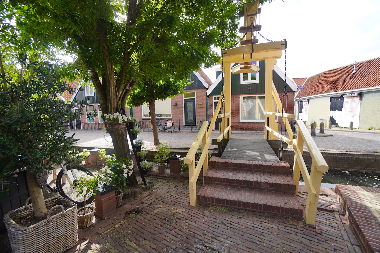 Traditional wooden drawbridge over a small canal in Volendam